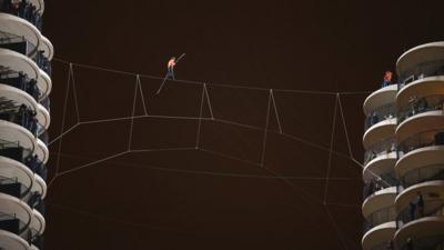 Man walking on tightrope