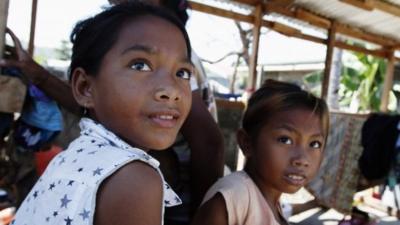 Two children at a shelter in Tanauan, Philippines