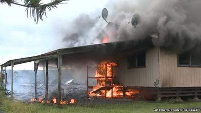 Close up of burning house in Pahoa (set alight by lava)