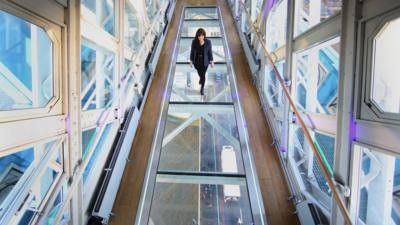 A woman walking on the bridge