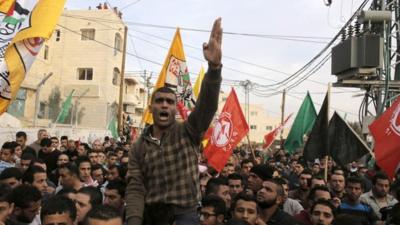 A mourner chants slogans during the funeral of 21-year-old Palestinian man Mohammed Jawabreh, whom medics said was shot dead by Israeli troops during clashes