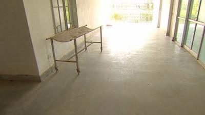 Hospital bed in corridor of hospital where Indian women underwent botched sterilisation surgery