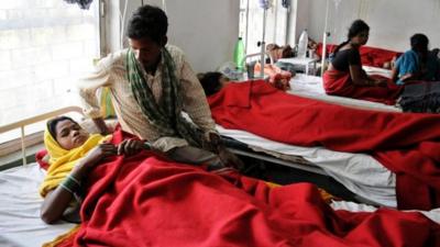 Indian women who underwent sterilization surgeries receive treatment at the District Hospital in Bilaspur