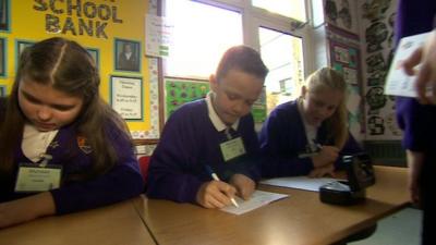 Children run a school bank