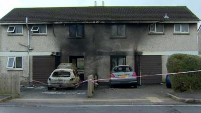 The fire badly damaged both houses and two cars, as Claire Savage reports