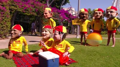 Protesters dress as various world leaders