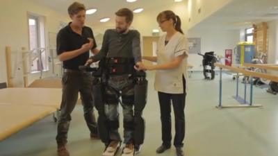 Gareth Herridge walks with help from the robotic skeleton