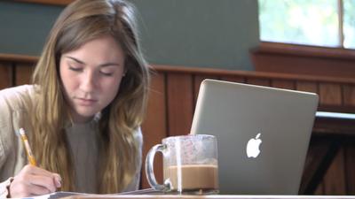 Woman in coffee shop with laptop