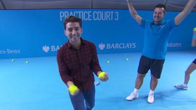 Ricky practising his ball boy skills