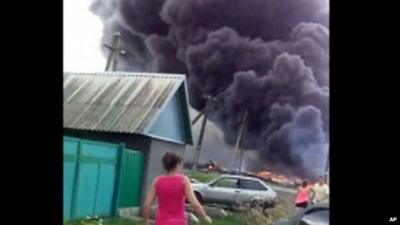 Smoke plumes rise after MH17 crash