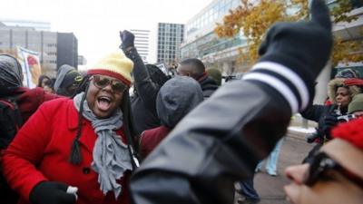 Demonstrators take part in a protest in front of the building where the grand jury is looking into the shooting death of Michael Brown in Clayton, Missouri, November 17, 2014
