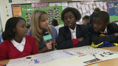 Jenny with school children