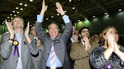 United Kingdom Independence Party leader (UKIP), Nigel Farage (C) and members of the UKIP team celebrate after Mark Reckless won the Rochester and Strood by-election at Medway Park