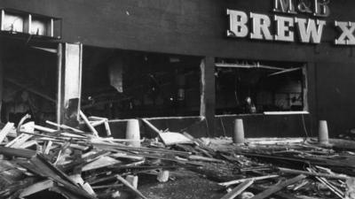 Wreckage and debris litter the street outside the "Mulberry Bush" public house in Birmingham in 1974