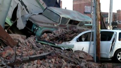 Building collapsed onto cars following a car chase