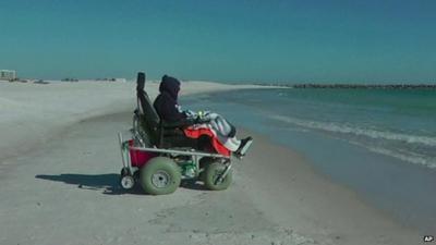 100-year-old Ruby Holt in her chair watching the ocean waves