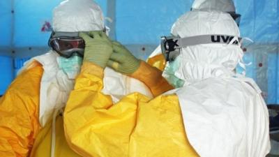 Medical staff must wear protective suits whenever they treat Ebola patients