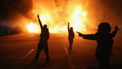 Some demonstrators celebrated as businesses burned in Ferguson