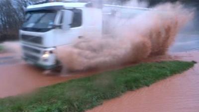 lorry going through puddle