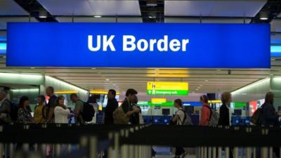 passengers passing through the border controls