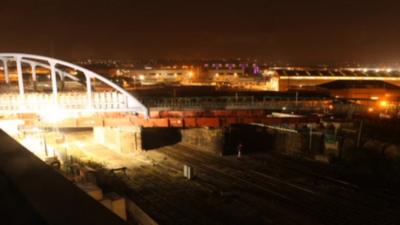 The bridge being inched into place