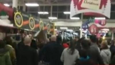 A crowd in a Tesco shop in Trafford, Manchester