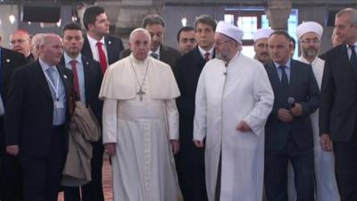 Pope Francis is shown around the Blue Mosque