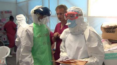 Doctors in protective clothing