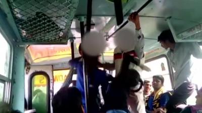 A girl hits a man on a bus in India