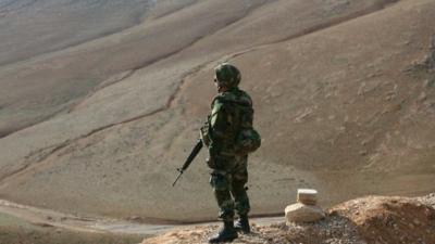 Lebanese soldier standing on hillside