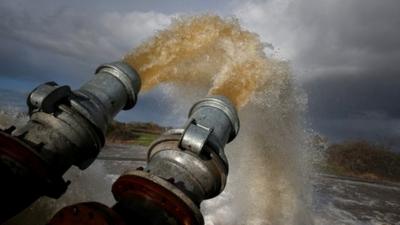 Flood water is pumped into the River Parrett