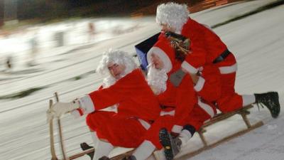 Santas on sleigh