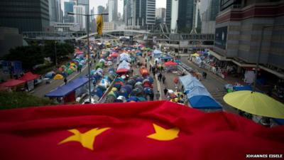 A folded Chinese flag is seen at the pro-democracy movements main protest site in the Admiralty district of Hong Kong on December 2, 2014