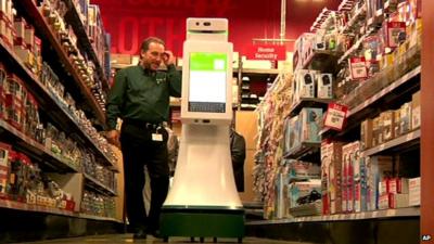 Wheeled robot assisting a shopper in a hardware store