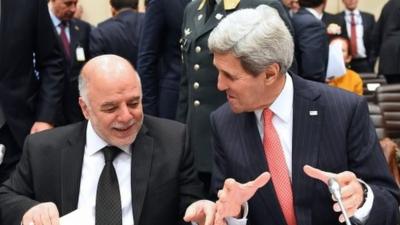 Iraqi PM Haider al-Abadi (l) and US Secretary of State John Kerry (r)