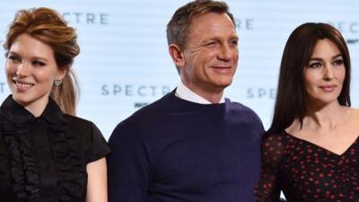 British actor Daniel Craig (C), French actress Lea Seydoux (L) and Italian actress Monica Bellucci (R) pose during an event to launch the 24th James Bond film "Spectre"