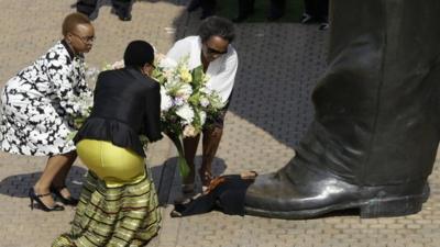 Graca Mandela lays a wreath at Mandela statue in Pretoria