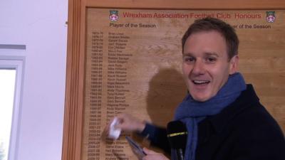Presenter Dan Walker accidentally wipes a name off Wrexham's honours board during a live broadcast of Football Focus.