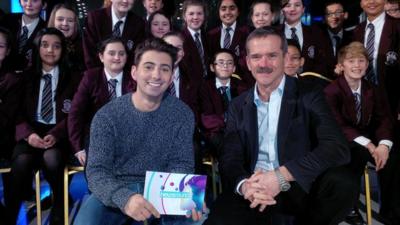 Ricky and a group of school kids ask Chris Hadfield questions