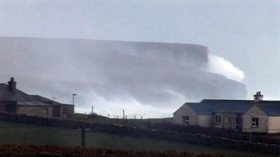 Waves crash on Orkney