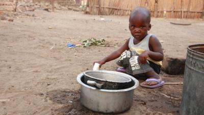 Boy in Malawi village (c) Victoria Gill