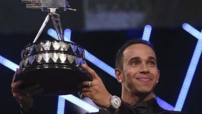 Lewis Hamilton holding SPOTY trophy