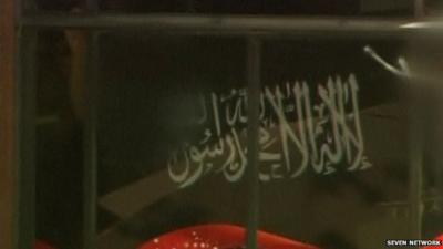 Close up of gunman's flag in Sydney cafe siege