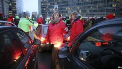 Belgian union representatives block one of the main thoroughfares in Brussels