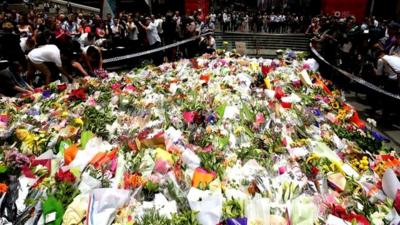 Flowers placed at scene of siege