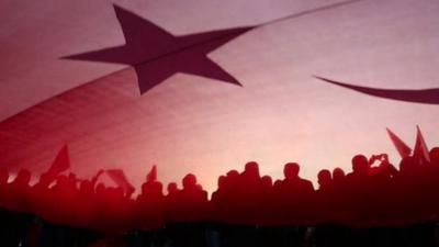 People holding the Turkish flag