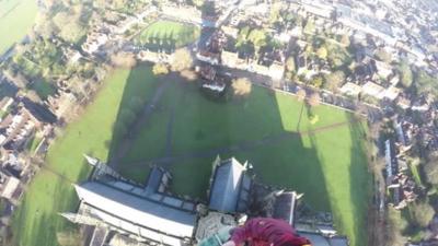 Workers at the top of Salisbury Cathedral's spire