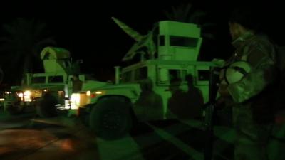 military vehicles at night