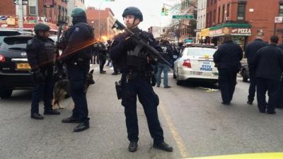 Police officers block off the scene of the shooting incident