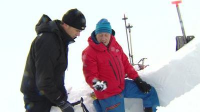 Rescuers trying to stop an avalanche